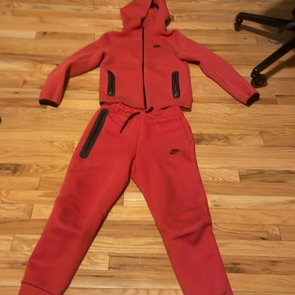 Red Nike tech kids worn